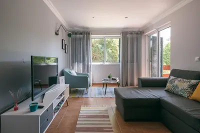 a living room with a couch and a tv at Atlantis Flat. Relaxing Moments in Machico