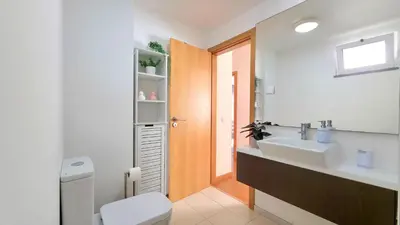 a bathroom with a sink and a mirror at Casa Silvana in Caniço