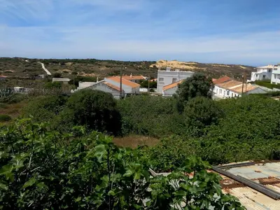 a view of a town with buildings and trees at Casa Luminosa in Carrapateira