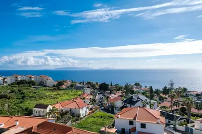 an aerial view of a small town with houses and the ocean at Vista Mar - Modern Sea Views In Caniço de Baixo in Caniço