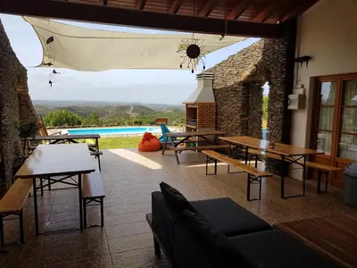 a backyard with a skateboard ramp and a pool at Russo Surf Resort - Vale Figueiras in Aljezur