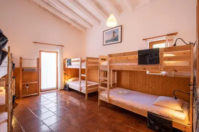 a room with bunk beds in a house at Russo Surf Resort - Vale Figueiras in Aljezur