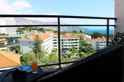 a view of a city from a balcony at MCStylo-Residenza in Funchal