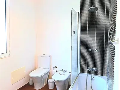 a bathroom with a white sink and a mirror at Valentina's House in Porto da Cruz