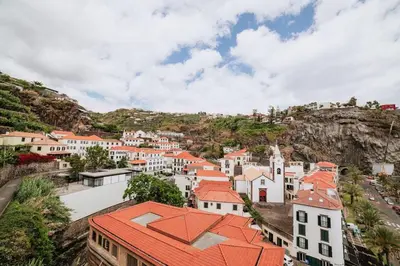 a view of a town on a mountain at Vila Mar Apartment in Ponta do Sol