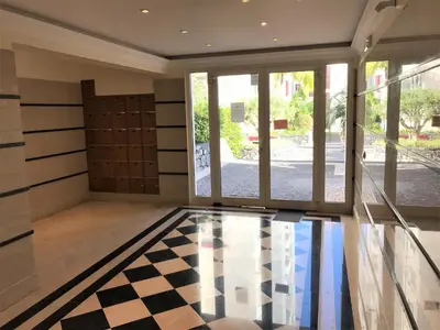 a room with a checkered floor and sliding glass doors at Funchal Apartment, with pool in Funchal