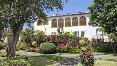 a house with a garden in front of it at Purple Studio in Funchal