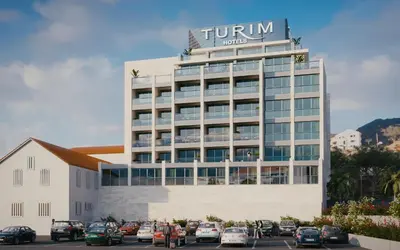 a hotel building with a sign on top of it at TURIM Santa Maria Hotel in Funchal