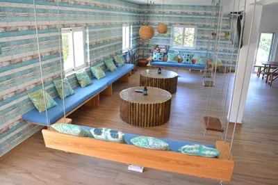 a room with couches and tables in a room at Sagres Natura in Sagres