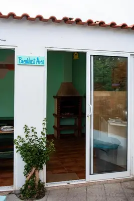 an open sliding glass door of a building at Sagres Natura in Sagres