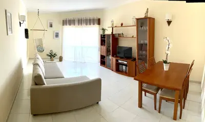 a living room with a couch and a table at Charming Salema in Salema