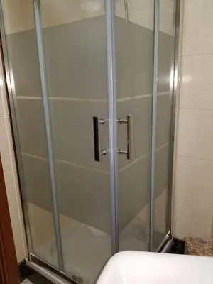a shower with a glass door in a bathroom at VIP Paradise Apartment in Machico