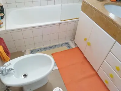a bathroom with a toilet and a sink at Lido Belissimo in Funchal