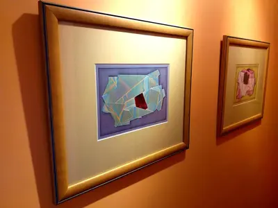 two framed pictures on a wall in a room at Lido Belissimo in Funchal