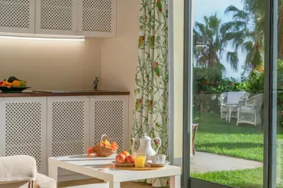 a living room with a bed and a couch at Casa do Papagaio Verde in Funchal