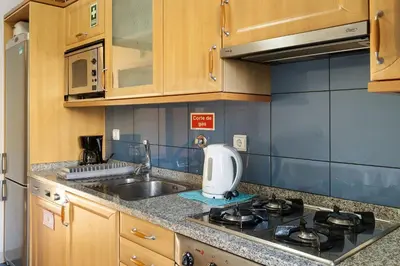 a kitchen with a sink and a counter top at Oliveira Atlantic View in Funchal