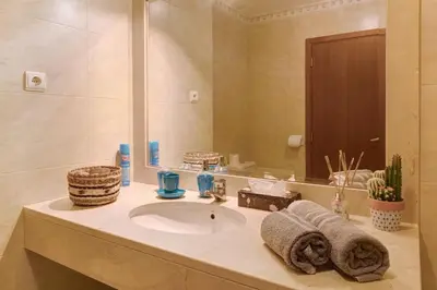 a bathroom with a sink and a mirror at Oliveira Atlantic View in Funchal