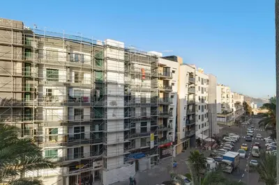 a tall building with scaffolding on the side of it at Oliveira Atlantic View in Funchal