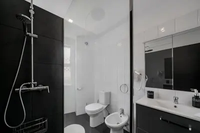 a bathroom with a toilet and a sink and a shower at Luxury View Apartment Funchal CENTRAL free parking FAMILIES in Funchal