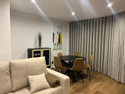 a living room with a couch and a table at Luxury View Apartment Funchal CENTRAL free parking FAMILIES in Funchal