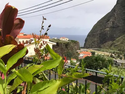 a view of the ocean from a mountain at Casa Oliveira Esmeraldo - Guest Houses in São Vicente