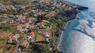 an aerial view of a village next to the ocean at Villa Albatroz in Caniço