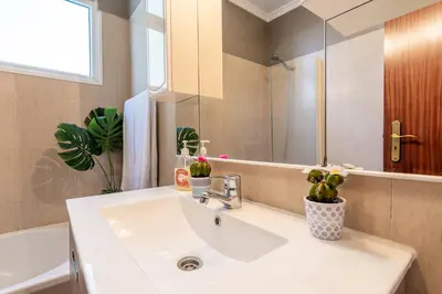 a bathroom with a sink and a mirror at Barcelos Apartment by Holiday Rental Madeira in Funchal