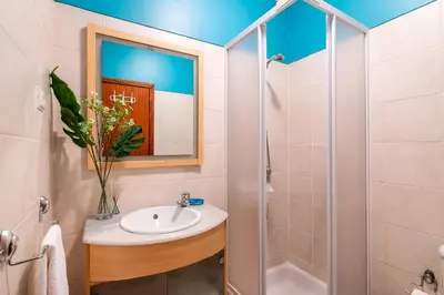 a bathroom with a sink and a shower at Barcelos Apartment by Holiday Rental Madeira in Funchal