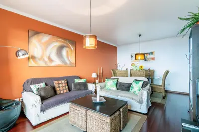 a living room with two couches and a table at Barcelos Apartment by Holiday Rental Madeira in Funchal