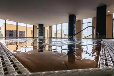 an indoor swimming pool with a lap poolvisorvisor at The Navigator - Colombus Apartments & Villas in Porto Santo