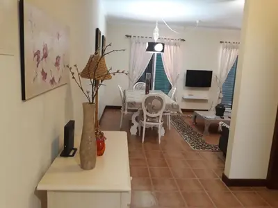 a living room with a couch and a table at Apartamentos Arrifes 1 in Porto Santo