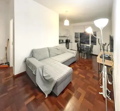 a living room with a couch and a table at Charming House in Funchal with Sea View in Funchal