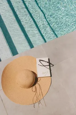 a table with food and utensils on it next to a pool at Casa LNNoa Boutique Room whit private pool in Lagos