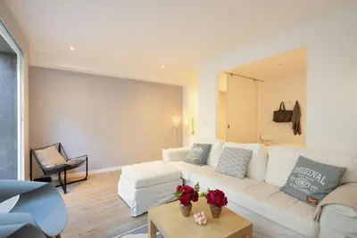 a living room with a white couch and a table at OLD TOWN Apartment W Interior Terrace - Barreirinha in Funchal