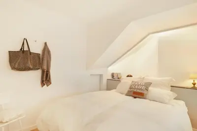a white bedroom with a white bed and a staircase at OLD TOWN Apartment W Interior Terrace - Barreirinha in Funchal