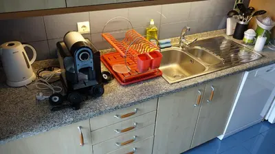 a kitchen with a counter with a stove top oven at Forum Madeira Ajuda Apartment in Funchal