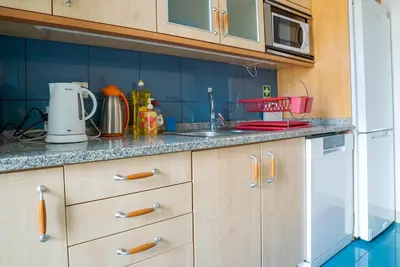 a living room with a large flat screen tv at Forum Madeira Ajuda Apartment in Funchal