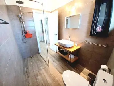 a bathroom with a toilet and a sink and a shower at Casa do Tonel in Sagres