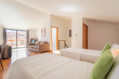 a bathroom with a sink and a shower and a mirror at Luz casas- BayLuz apart,pool,beach, tennis, wifi,aircon in Luz