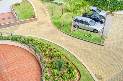 an aerial view of a car parked in a parking lot at Levada dos Piornais, a Home in Madeira in Funchal