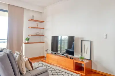 a living room with a couch and a tv at Levada dos Piornais, a Home in Madeira in Funchal