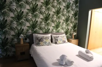 a bedroom with a bed with towels on it at City Garden by Madeira Best Apartments in Funchal