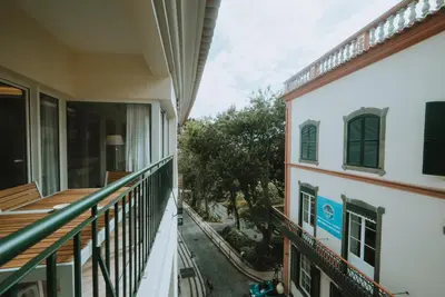 an apartment balcony with a view of a yard at City Garden by Madeira Best Apartments in Funchal