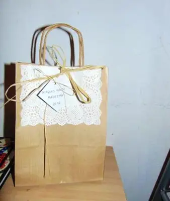 a paper bag with a bow on top of it at Charming house in Machico with mountain view and garden in Machico