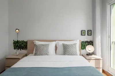 a bedroom with a large bed with white sheets and pillows at Ilhéus IV by An Island Apart in Funchal