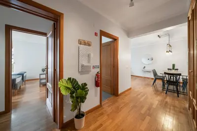 a living room and dining room with a dining table at Ilhéus IV by An Island Apart in Funchal