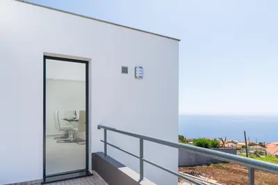 a balcony with a toilet on the side of a building at Casa Campos , Modern two bedroom house in Loreto in Achada de Cima