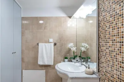 a bathroom with a sink and a mirror at Casa Campos , Modern two bedroom house in Loreto in Achada de Cima