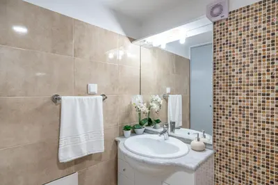 a bathroom with a sink and a mirror at Casa Campos , Modern two bedroom house in Loreto in Achada de Cima