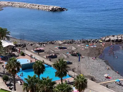 an aerial view of a beach with people and the ocean at VALE MAR Guest in Ribeira Brava